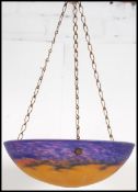 A vintage 20th century Monet style coloured glass shade of conical / circular form.