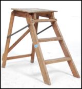 A vintage Edwardian miniature folding wooden three step ladder with lattice frame.