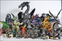 A large collection of Gothic / medieval dragon figurines to include large dragon sculpture,