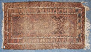 An early 20th century handwoven Islamic Persian prayer rug with reg ground and central Mihrab