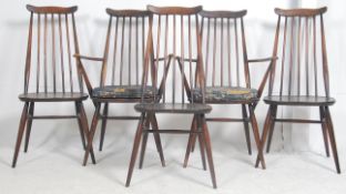 A set of eight Ercol 20th century beech and elm wood dining chairs to include 2 carvers.