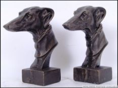 Two vintage style cast iron Greyhound busts sculptures raised on square plinth bases. 21cm tall.