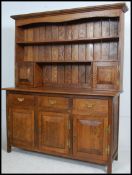 An 18th century style solid golden oak dresser.
