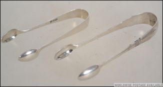 2 pairs of silver hallmarked sugar tongs,