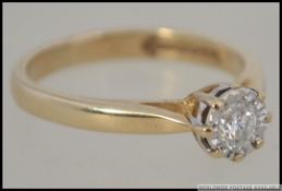 A 9ct gold single stone diamond ring being claw mounted and illusion set. The diamond approx 10pnts.