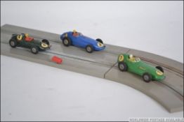A collection of Wren Formula 152 slot cars and accessories to include 3 slot cars,