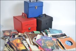 A large collection of 60s to 80s vinyl singles some with record cases.