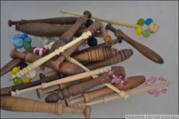 A collection of lace bobbins to include examples from the East Midlands, French and others.