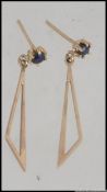 A pair of 9ct god and sapphire ladies earrings drop and post earrings,