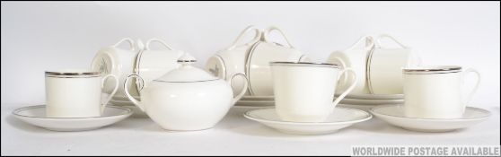 A part Royal Doulton Platinum Concorde pattern tea service.