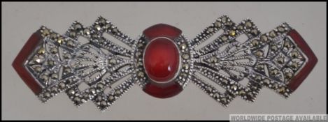 An unusual believed Scottish silver, agate and marcasite ladies brooch of bow form with pin verso.