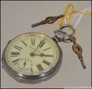 A silver early 20th century Patent lever open faced crown wind pocket watch with faceted hands and