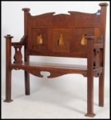 A Victorian Arts & Crafts oak inlaid hall settle bench.
