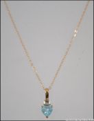 A 9ct gold and aquamarine coloured stone set to a fine linked 9ct chain. Length 46cms / Weight 1.