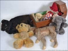 A box containing vintage dolls, teddy bears, soft toys,
