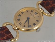 A 1970's 18ct gold and cluster set ring being London hallmarked with ribbed tapering shank,