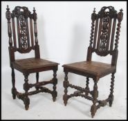 2 Victorian carved oak barley twist Carolean hall chairs of barley twist form having panel seats