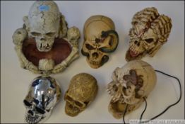 A good group of novelty skulls to include battery operated light up examples,