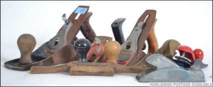 A small collection of vintage 20th century wood working planes to include Record, Stanley,