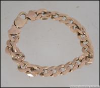 A 9ct gold belcher diamond cut kerb linked bracelet with lobster clasp.