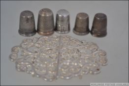 A collection of silver thimbles to include hallmarked examples.
