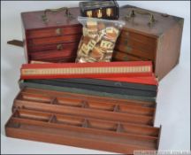 A collection of vintage 20th century Mah Jong sets.