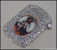 A silver plated vesta case with belle epoque scene of champagne and dancing girls. Weight 20.