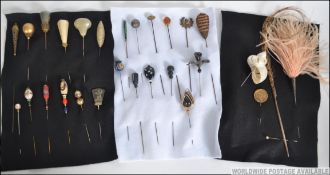 An excellent collection of 19th and 20th century hatpins to include handpainted, oversized, cone,