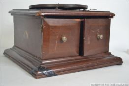 A vintage early 20th century mahogany cased table top side winding gramophone