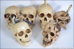 A good group of ornamental novelty collectable skulls ready for Halloween to include a pestle and