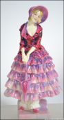 A good early Royal Doulton ceramic figurine titled Priscilla HN1559.