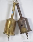 A pair of clockwork roasting jack with keyhole.