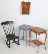 A Victorian aesthetic movement rocking chair being ebonised having chinoserie decoration together