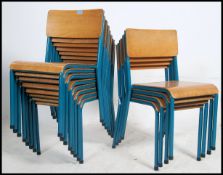 A set of twelve vintage industrial mid 20th century church / village hall stacking chairs.
