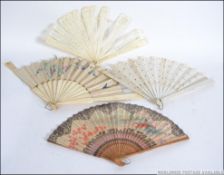 A group of four vintage hand fans to include a bone fret pierced one, silk,