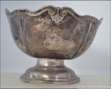 A Victorian silver hallmarked Walker & Hall rose bowl raised on terraced base with leaf shaped cast