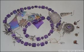 A collection of silver items to include a hallmarked fob.
