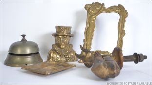 A collection of brasswares to include a Beefeater money box, a Waterloo ashtray,