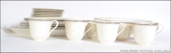 A Royal Doulton Platinum Concord part tea service to include cups, platters,