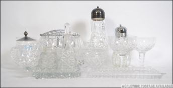 A collection of vintage early and later 20th century cut glass to include a cruet set on glass tray,