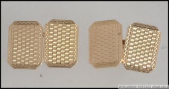 A pair of 9ct gold gentlemans cufflinks being engine turned with concentric circle decoration,