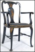 A late 19th century aesthetic movement armchair being raised on shaped legs with chinoserie