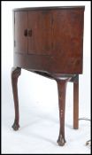 A 1930's Art Deco walnut radiogram of unusual form with decorative facia.