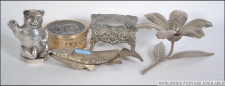 A collection of silver plated items to include a flower with petals that become ashtrays,