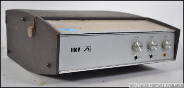A vintage mid 20th century four speed portable record player by HMV,