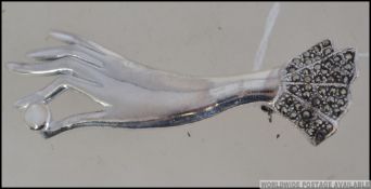 A good 925 silver and marcasite with mother of pearl brooch in the Art Deco style.