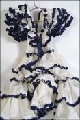 A vintage 1970's Spanish made Flamenco dress in white cottom and blue ribbon type frill with lined