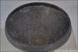 A circa 1907 believed Oliver Baker for Liberty's Tudric pewter bowl on three feet with cornelian