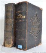 A pair of family bibles the first being a National family bible from 1918 with brass clasps,
