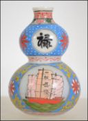A miniature Chinese glass gourd vase having painted panels depicting cats,